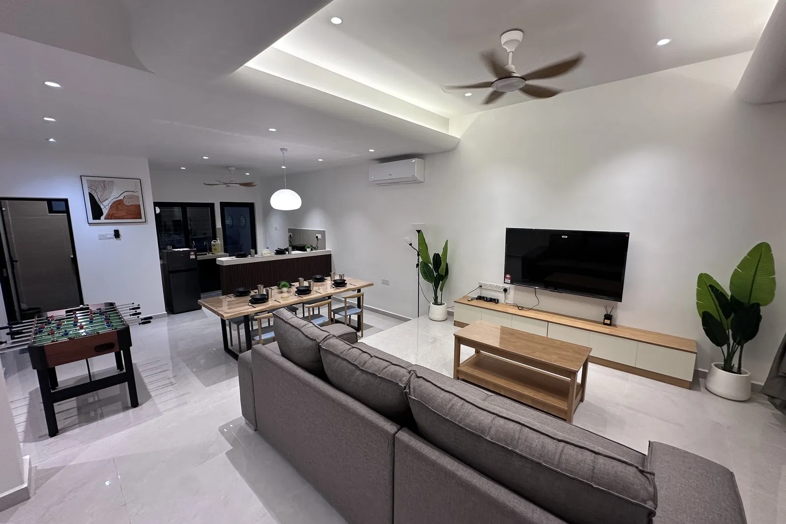 Bright open-plan living room at Landak Kawan Fun House