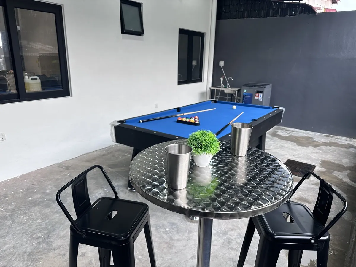 Private games courtyard with pool table and seating