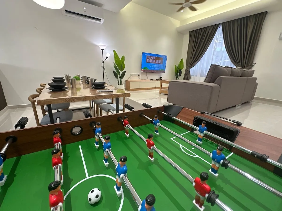 Open-plan living room with foosball table