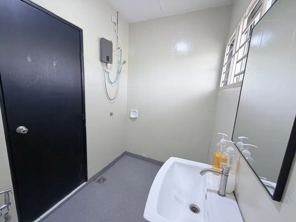 Modern bathroom with a walk-in rain shower and sleek tiled walls