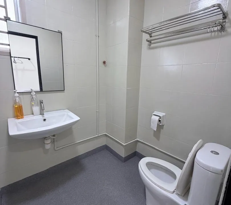 Second bathroom with rain shower and neatly tiled surround