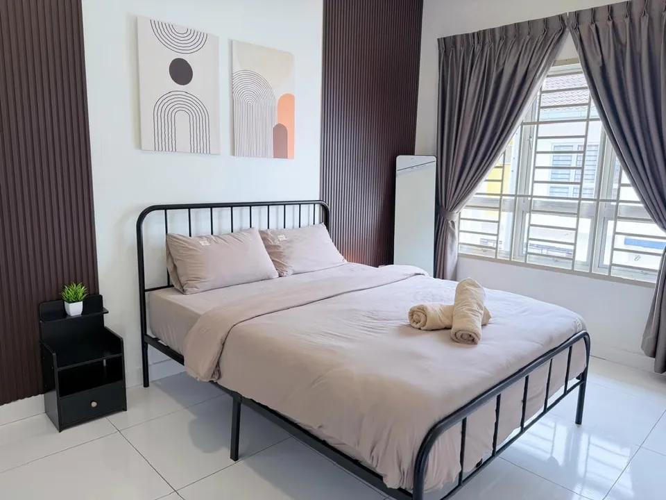 Third bedroom with a neatly dressed bed and simple, calming decor