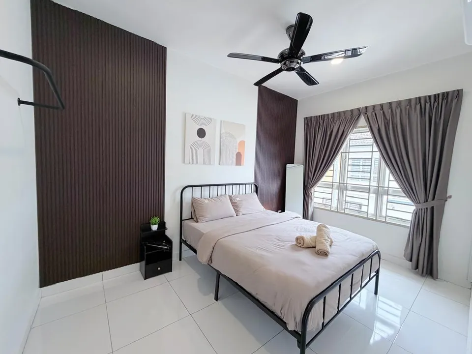 Fourth bedroom with a comfortable bed and bright natural light